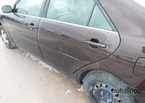 2002 Toyota Camry Le z USA, uszkodzony, nr VIN JTDBE32K720119418